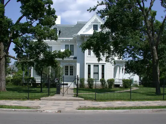 The Truman Home at 219 North Delaware Street in Independence, Missouri, a white Victorian house behind an iron fence