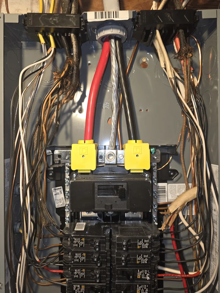 Old cloth-covered branch circuits landed into a newer breaker panel